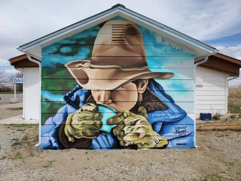 Cowboy Up mural in progress by Bimmer Torres at Zayra's Cafe in Springer, New Mexico