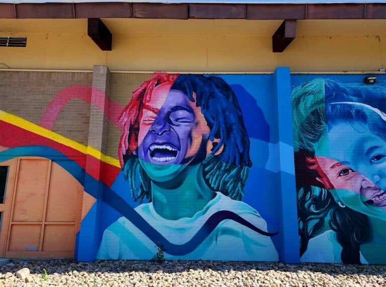 Kids mural by Bimmer Torres at Family Star Montessori in Northeast Denver